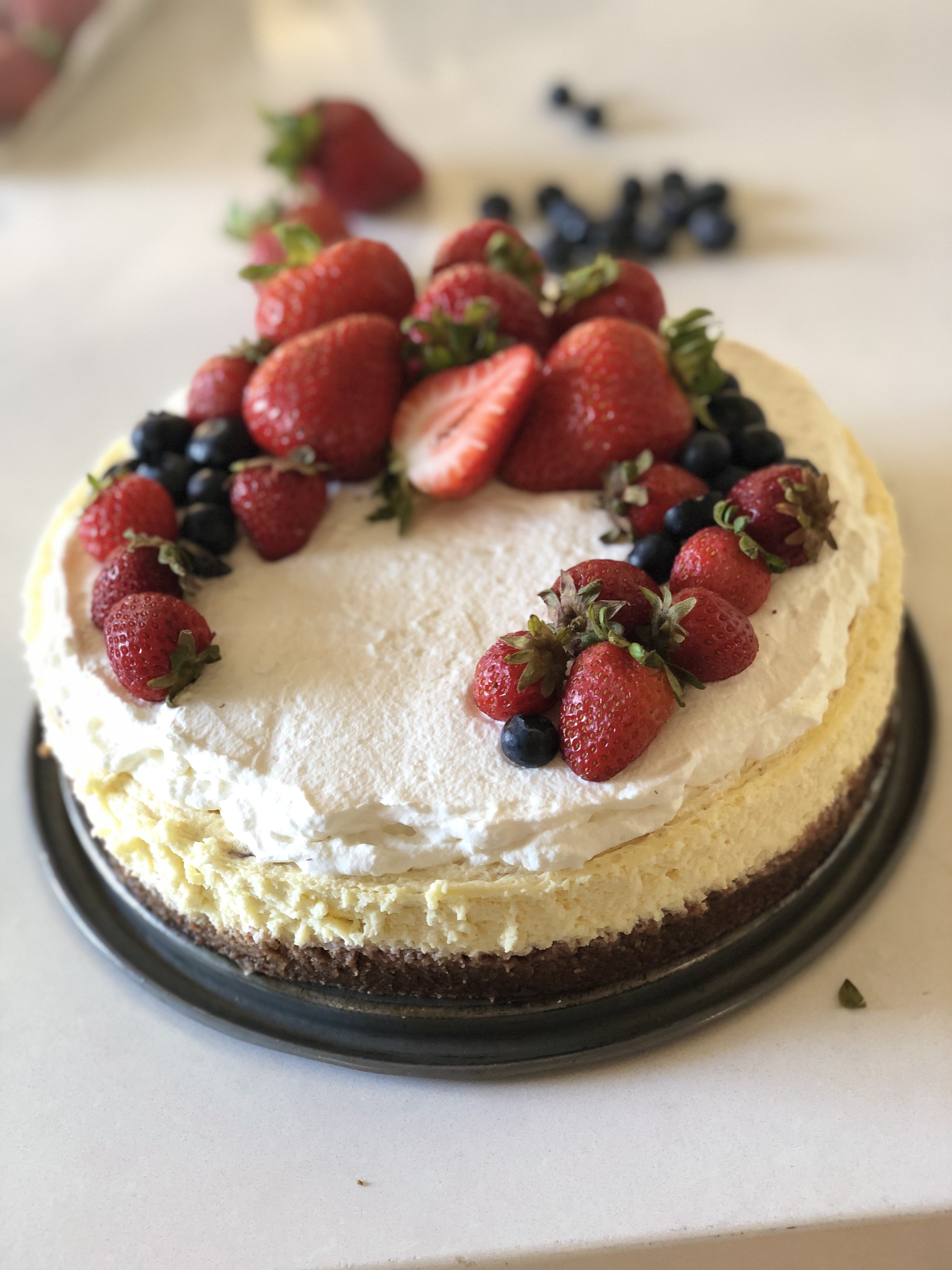 keto cheesecake with fresh berries on top