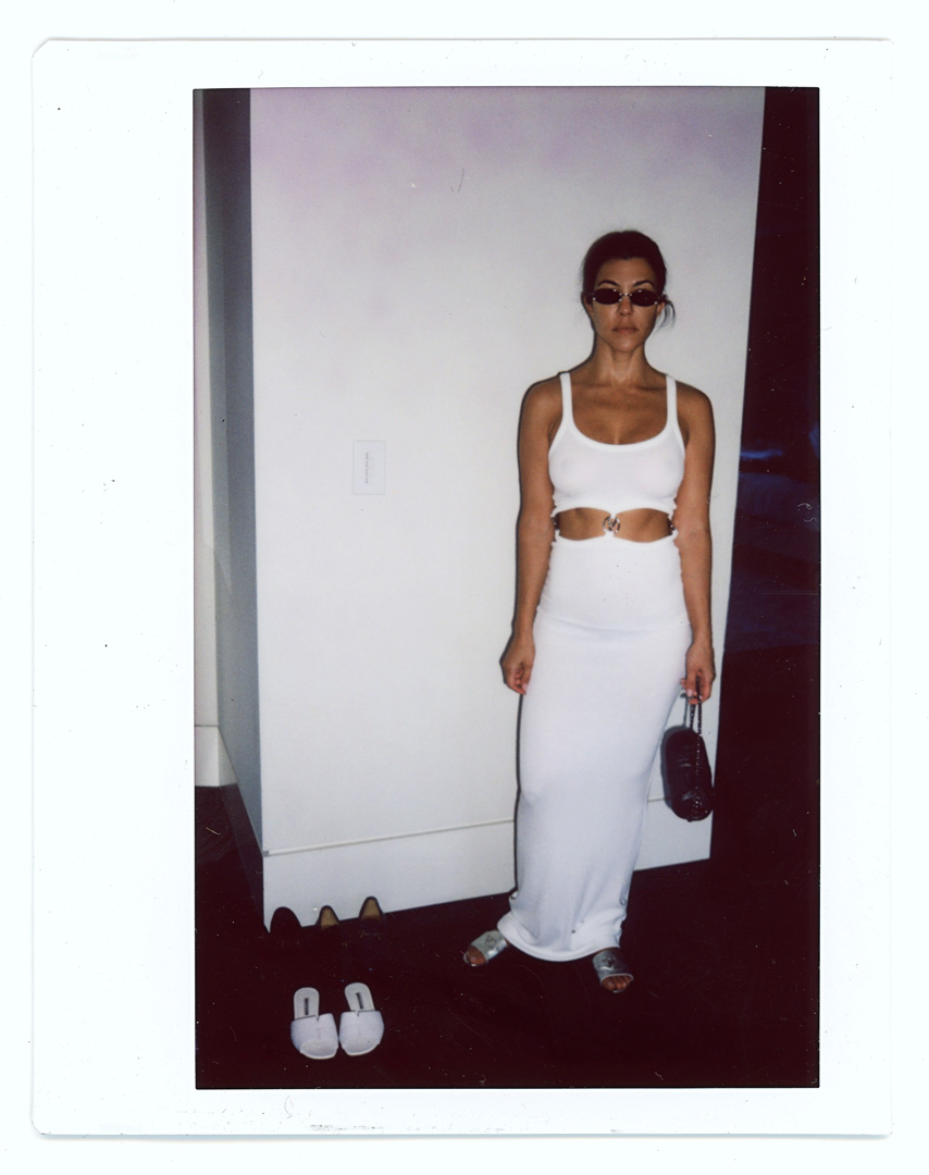 Kourtney Kardashian wearing white dress
