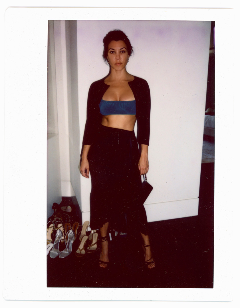 Kourtney Kardashian wearing bra top and skirt