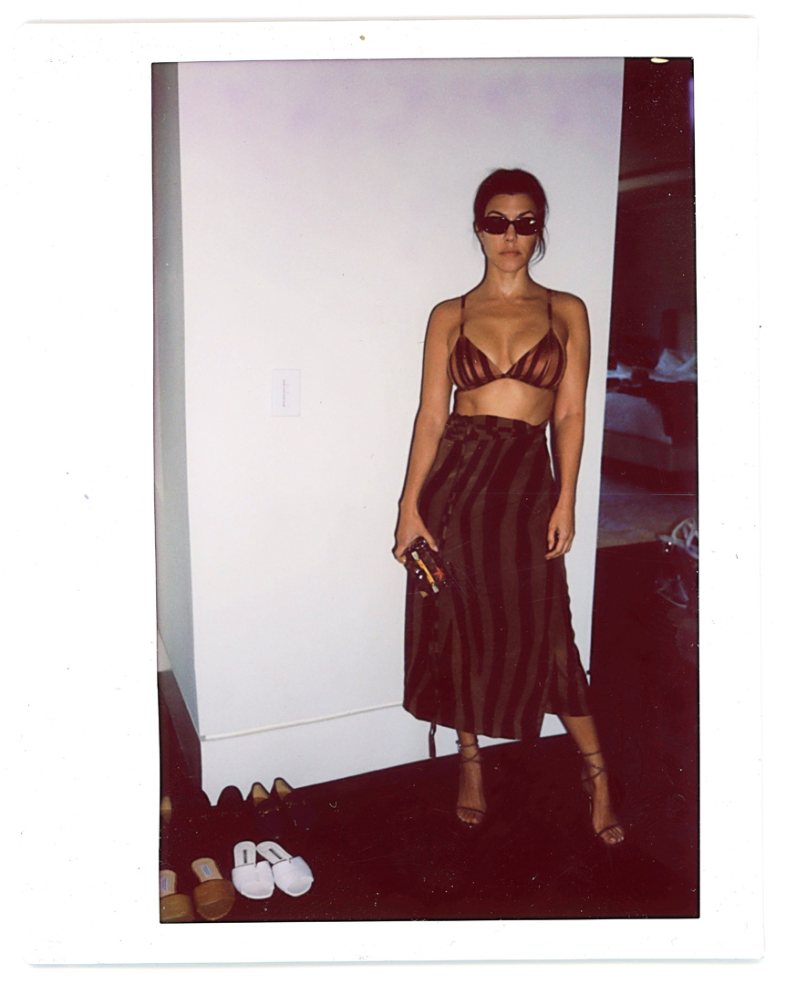 Kourtney Kardashian wearing brown bra top