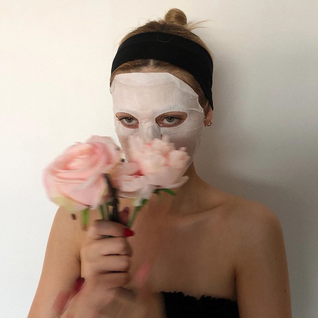 woman wearing sheet mask