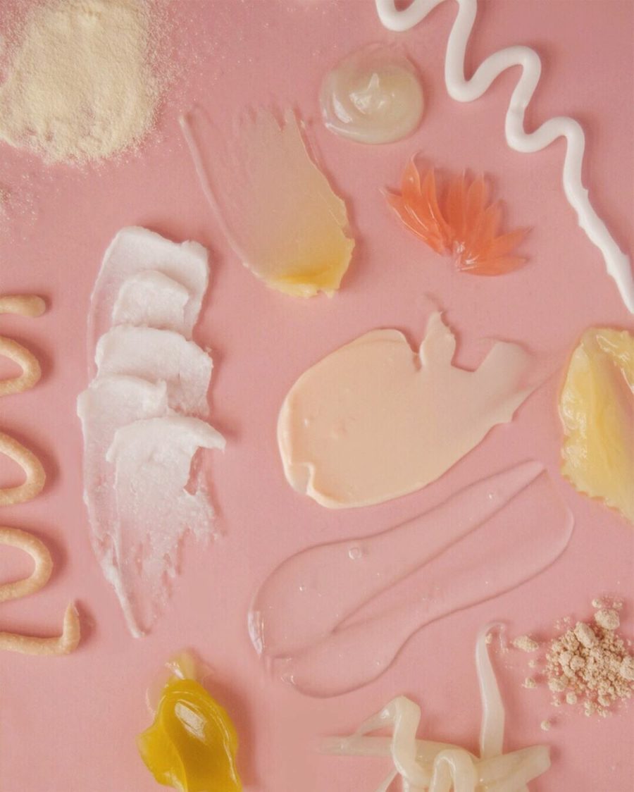 face moisturizer swatches on pink background