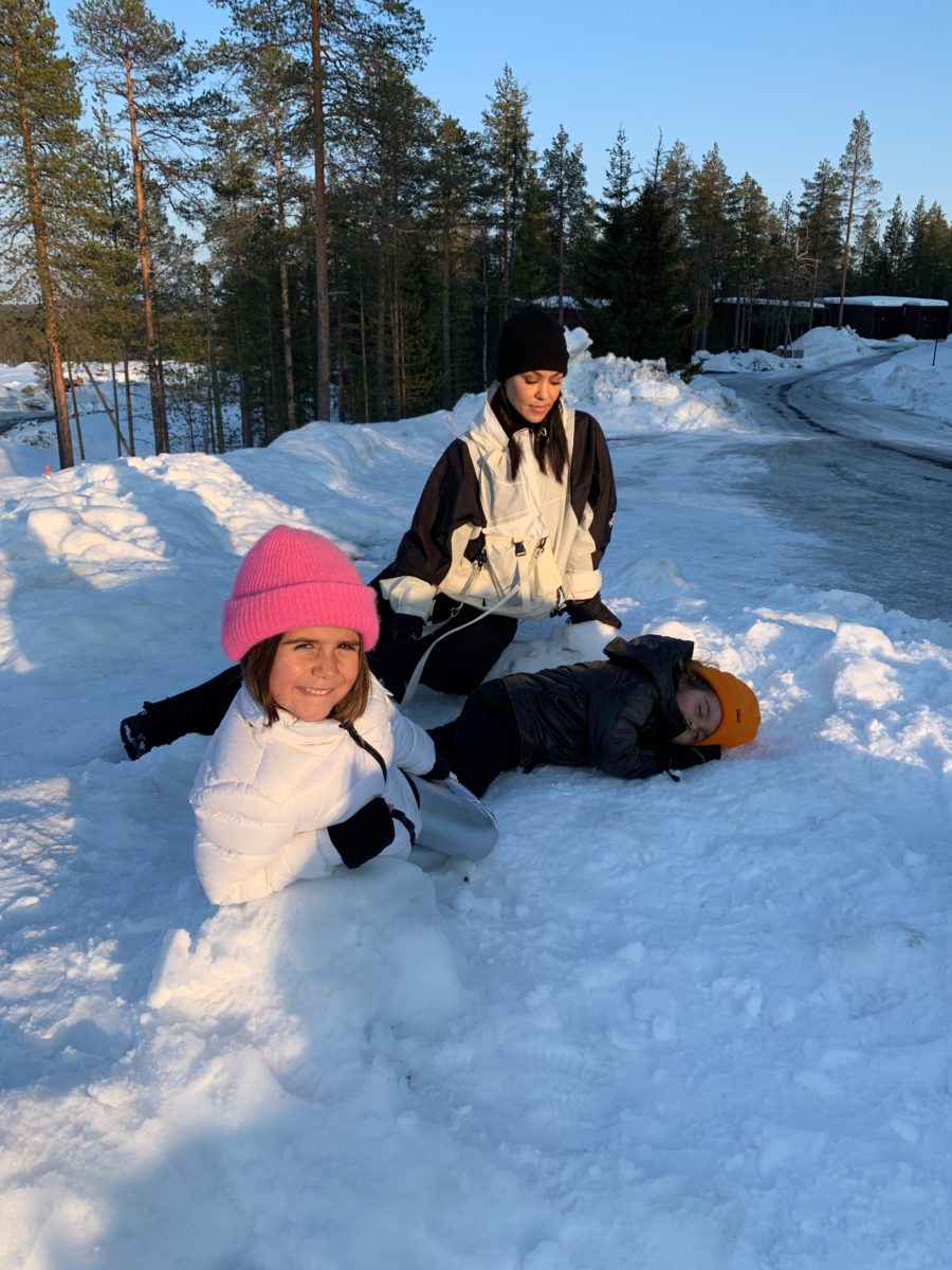 kourtney kardashian and Penelope playing in the snow in finland