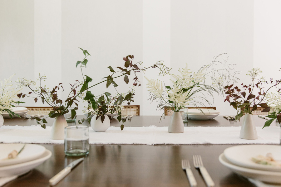 flowers in vases in dining room table