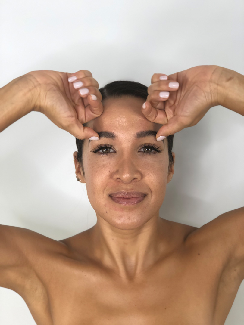 woman showing how to give a facial massage Step7A