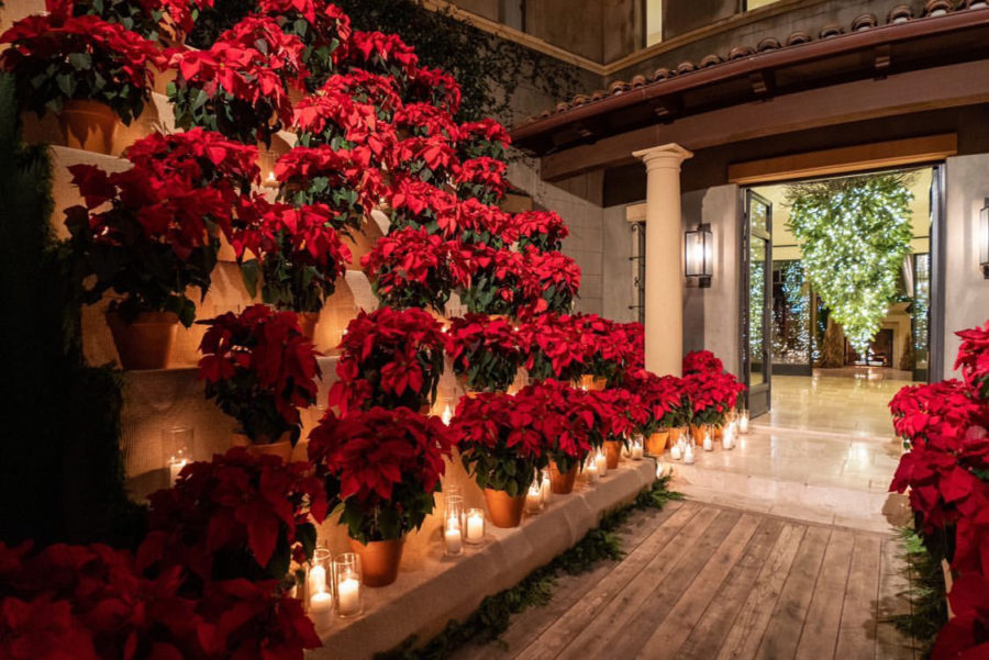 Inside The 2019 Kardashian Christmas Eve Party candles and poinsettias
