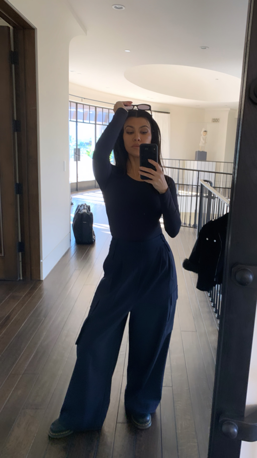 kourtney kardashian taking a mirror selfie