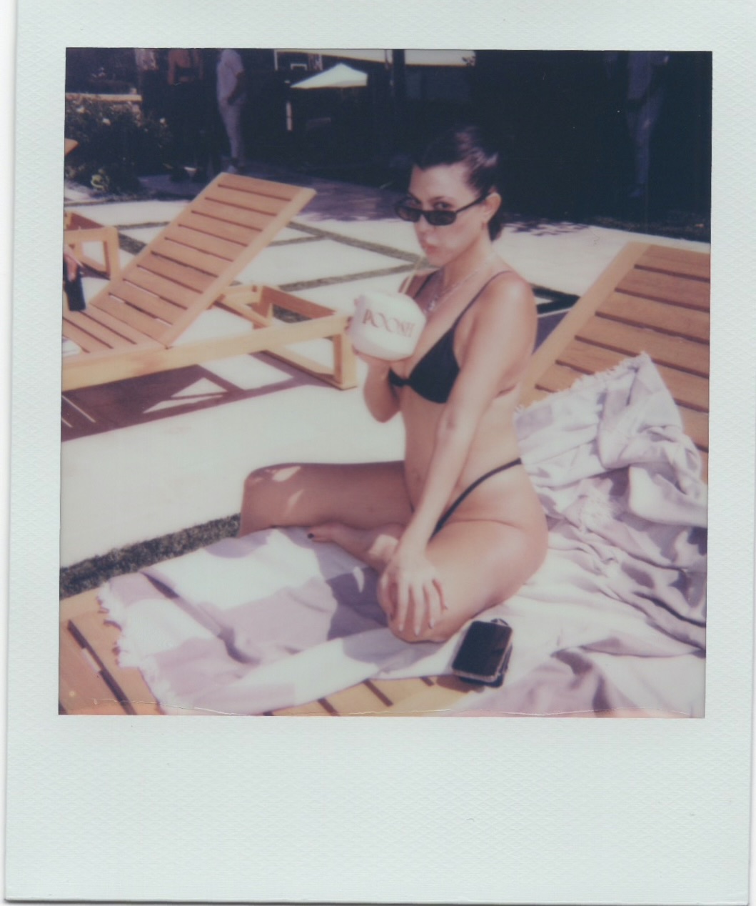 kourtney kardashian at poolside with poosh event drinking coconut