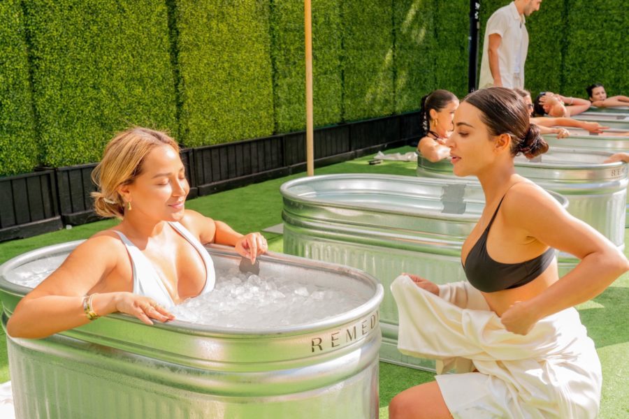 kim kardashian and adrienne bailon in ice bath poosh poolside event