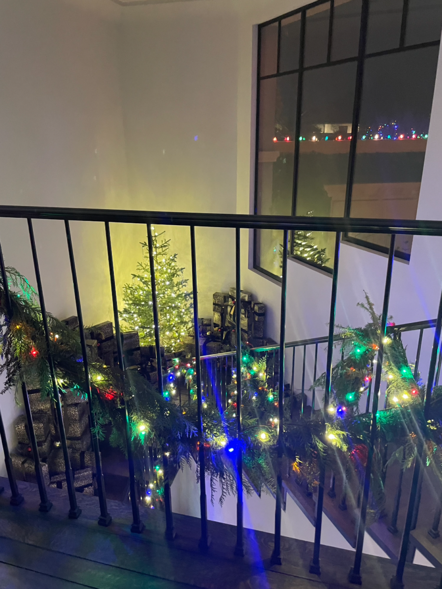 Kourtney Kardashian House Christmas Decor lights on the rail