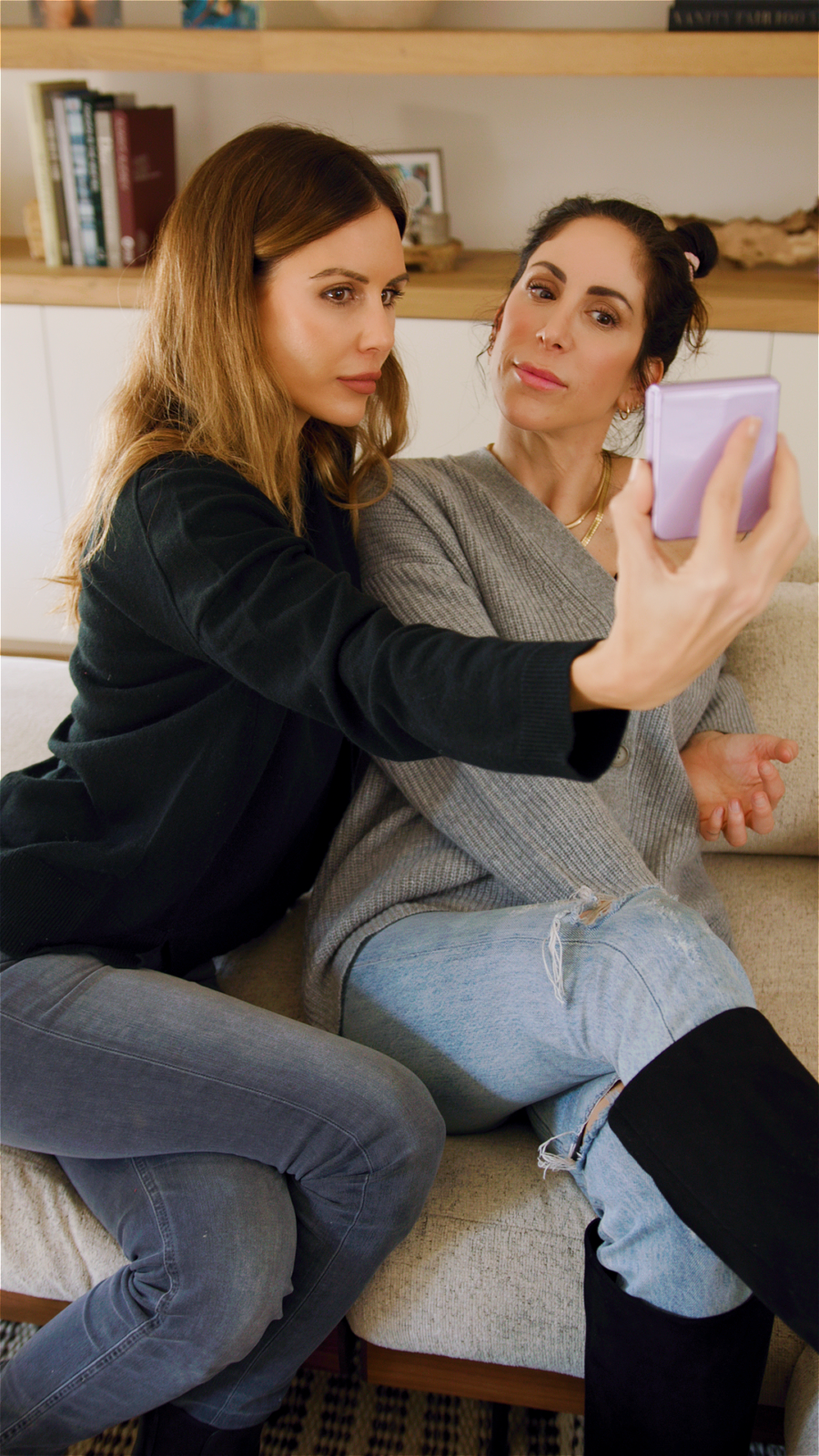 sam hyatt and sarah howard taking selfie on samsung phone