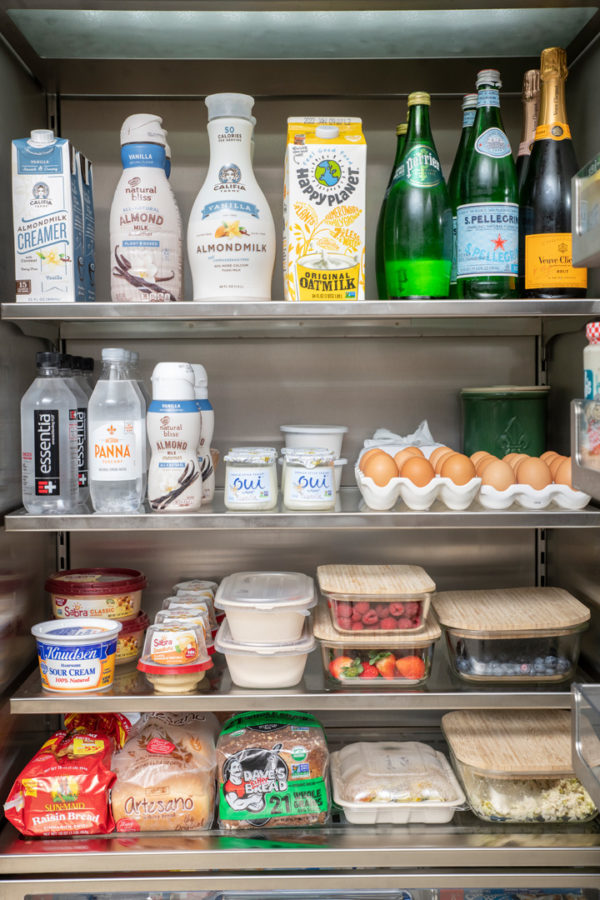 Kris Jenner refrigerator dairy section with door open