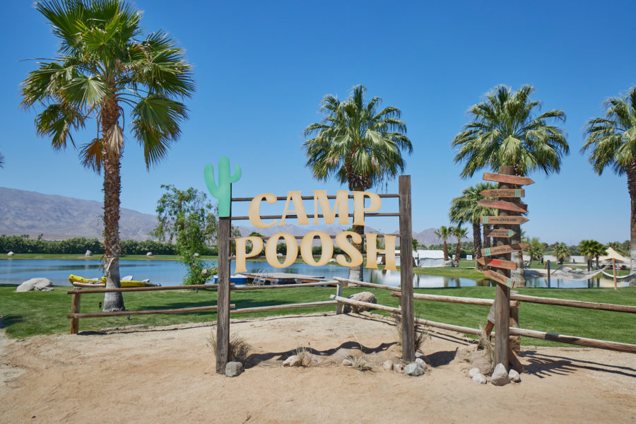 camp poosh sign and palm trees