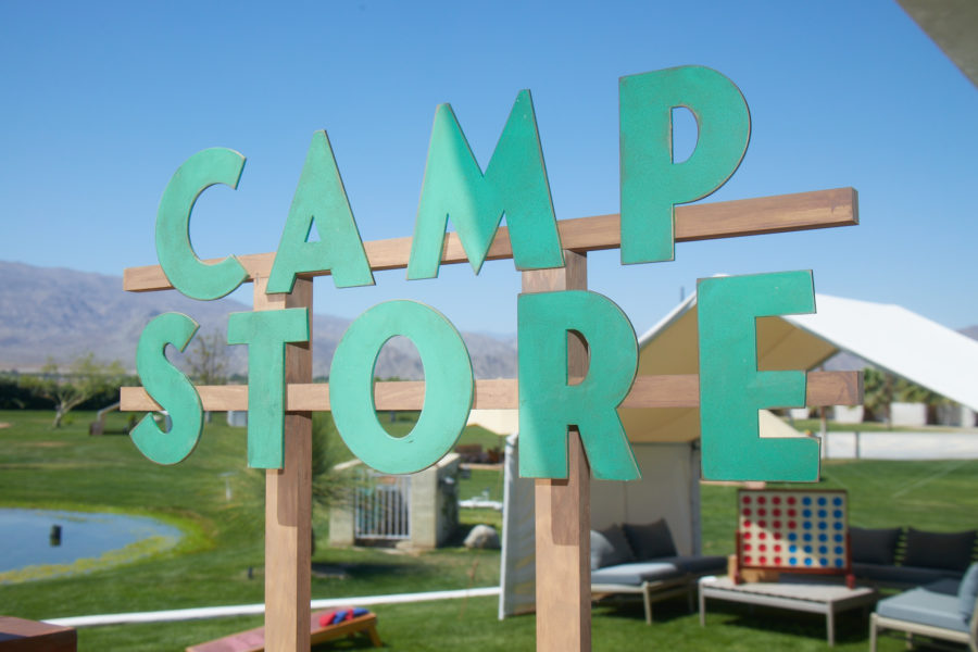 camp poosh store sign