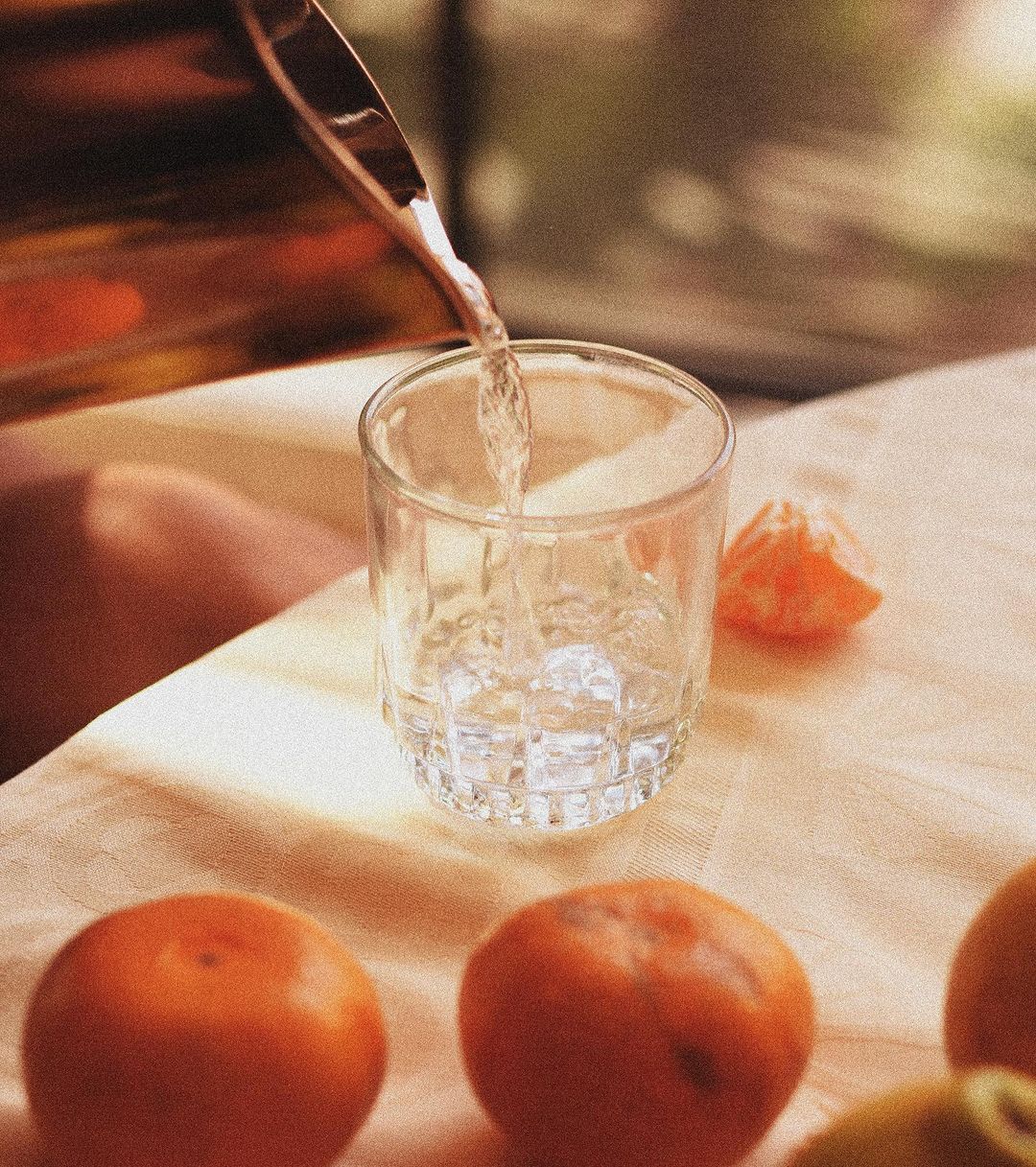 water being poured around oranges