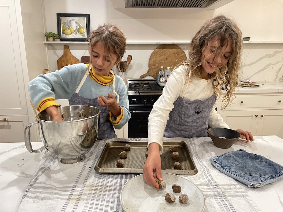 two kids making Gingersnap Cookies