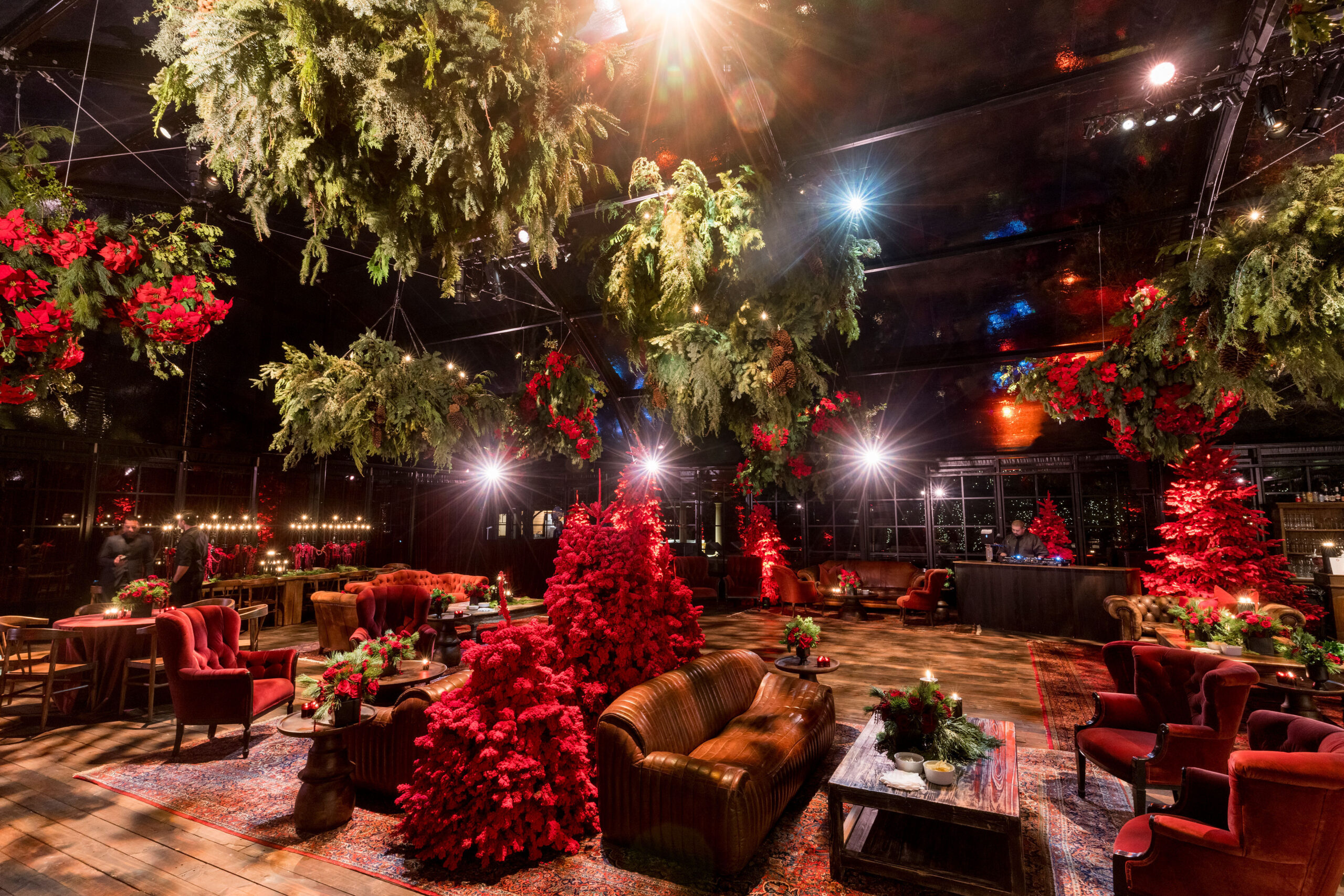 kourtney kardashian barker&#8217;s 2022 Christmas eve party glass tent lush plants and leather seating