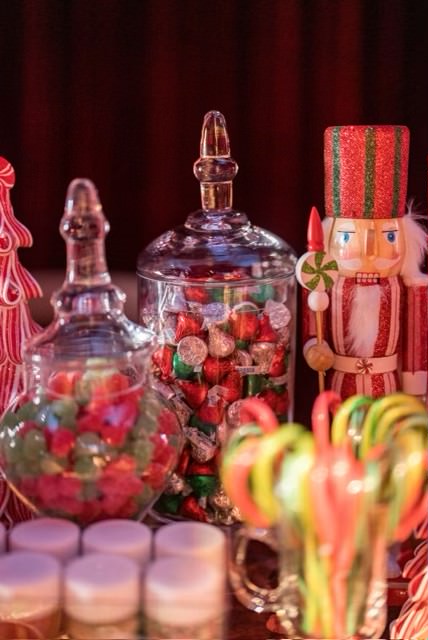 Candy in jars next to nutcracker figurine at Kourtney Kardashian Barker Christmas Eve 2022