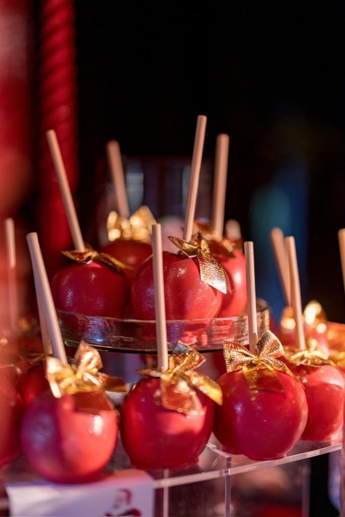 Kourtney Kardashian Barker Christmas Eve party 2022 candy apples