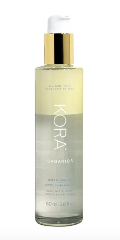 glass bottle with greenish clear milky cleansing oil by kora organics