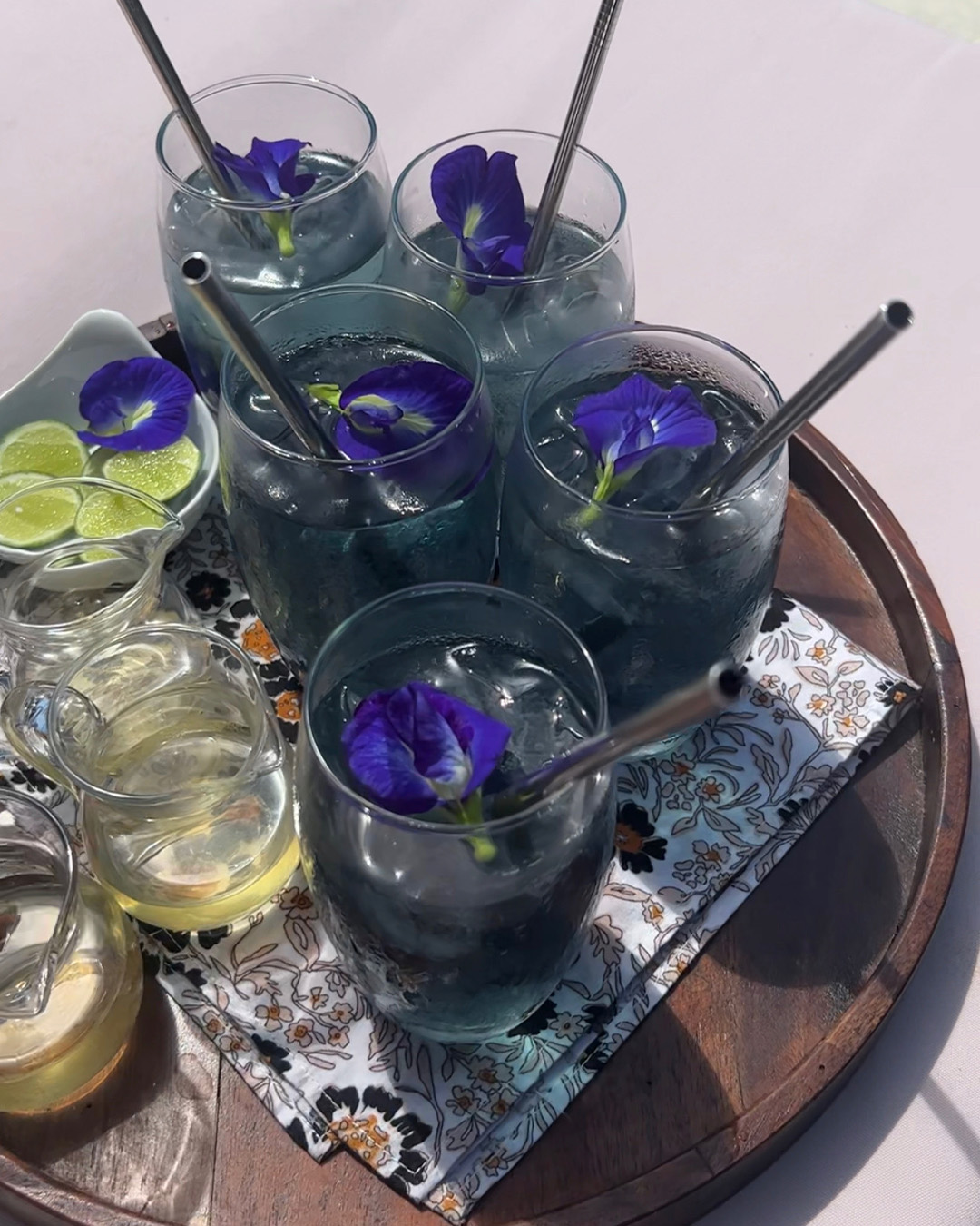 Blue Clitoria Ternatea in glassware with edible flower