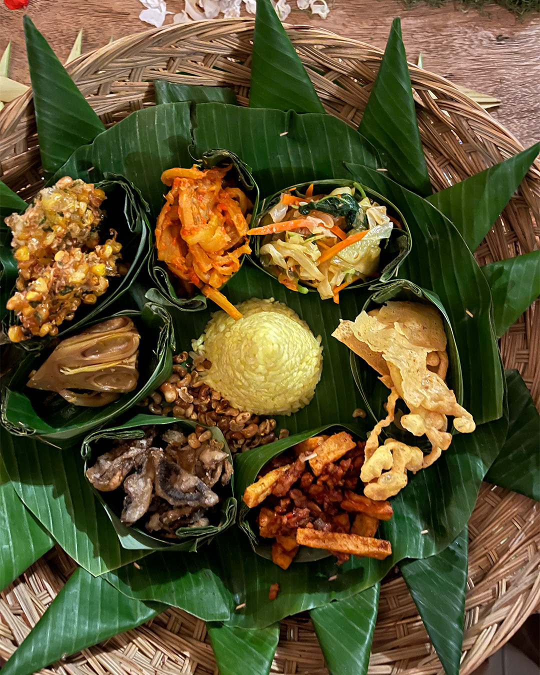 Small portion of Balinese dishes in brown woven basket