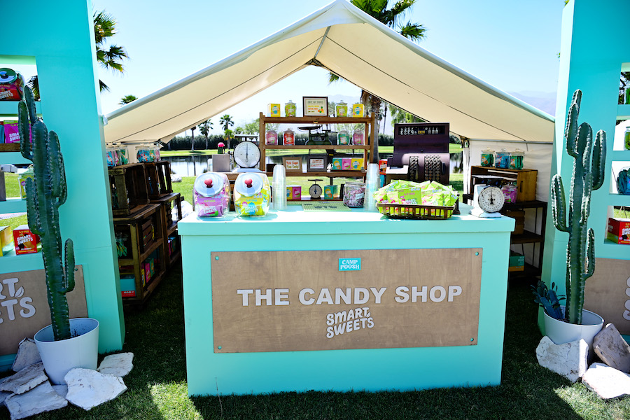 A blue booth full of SmartSweets candy