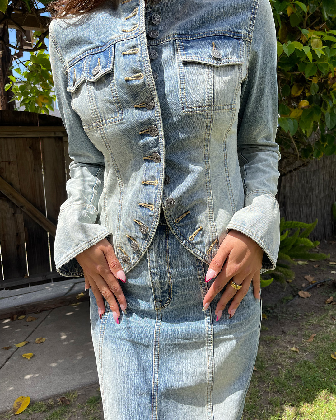 Pic of woman wearing Lee jeans denim jacket and skirt